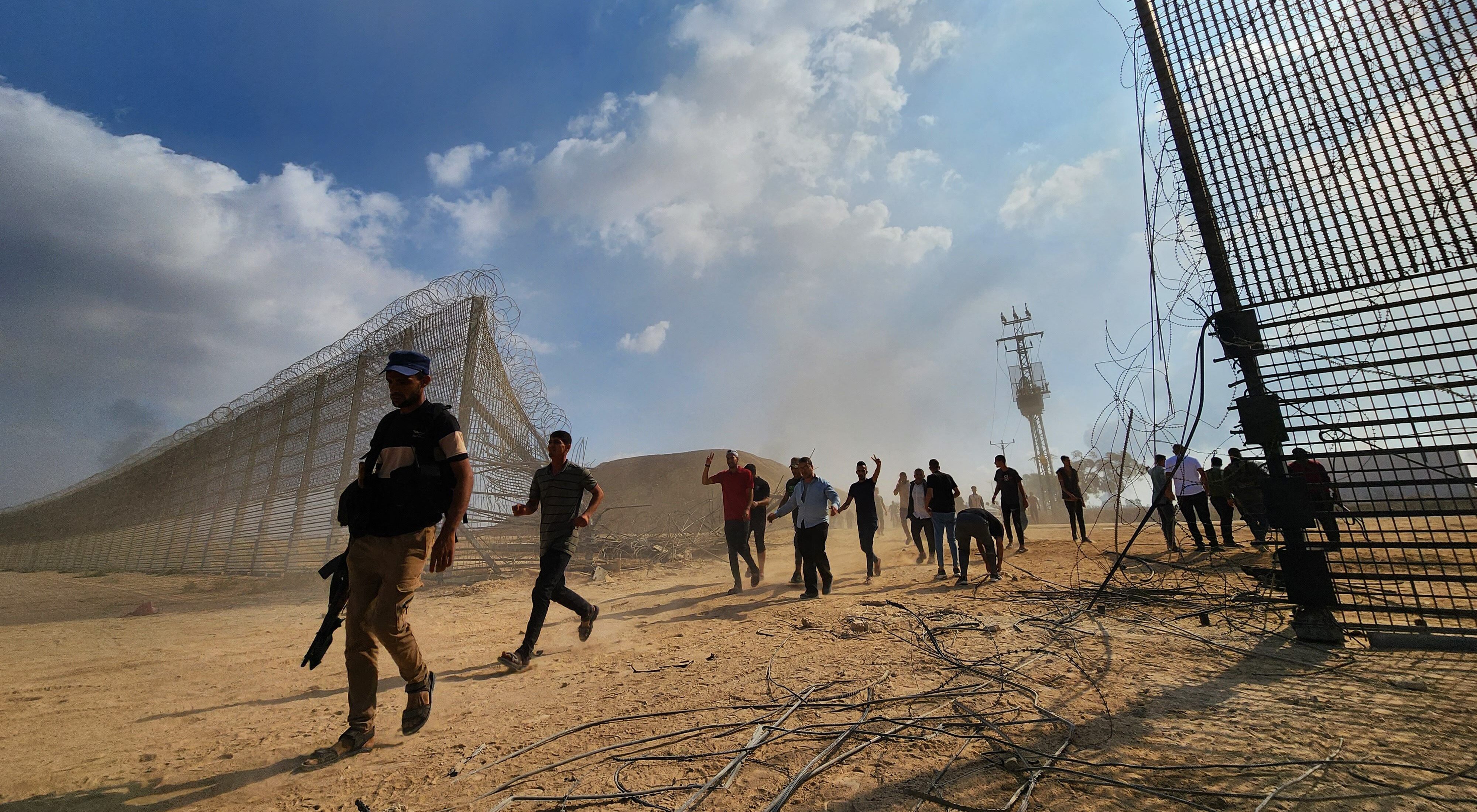 GAZA CITY, GAZA - OCTOBER 07: Hamas' armed wing, the Izz ad-Din al-Qassam Brigades enter the Israeli side of the fence in Gaza City, Gaza on October 07, 2023. Hani Alshaer / Anadolu Agency (Photo by Hani Alshaer / ANADOLU AGENCY / Anadolu Agency via AFP)